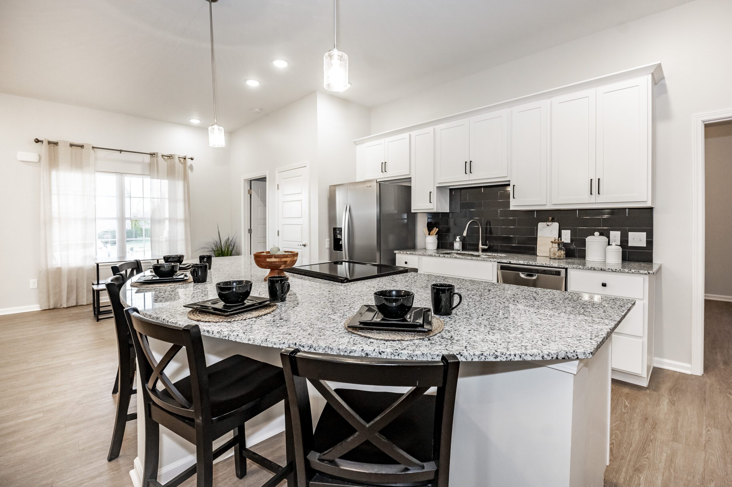 Bright kitchen area with modern appliances and seating
