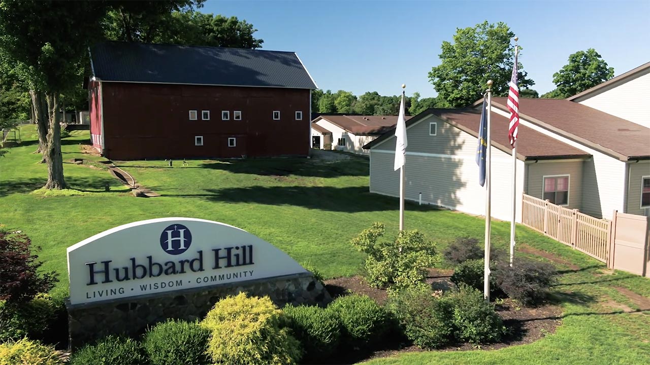Exterior view of Hubbard Hill Village with landscaping