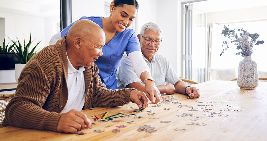 Residents and staff enjoying a puzzle activity together