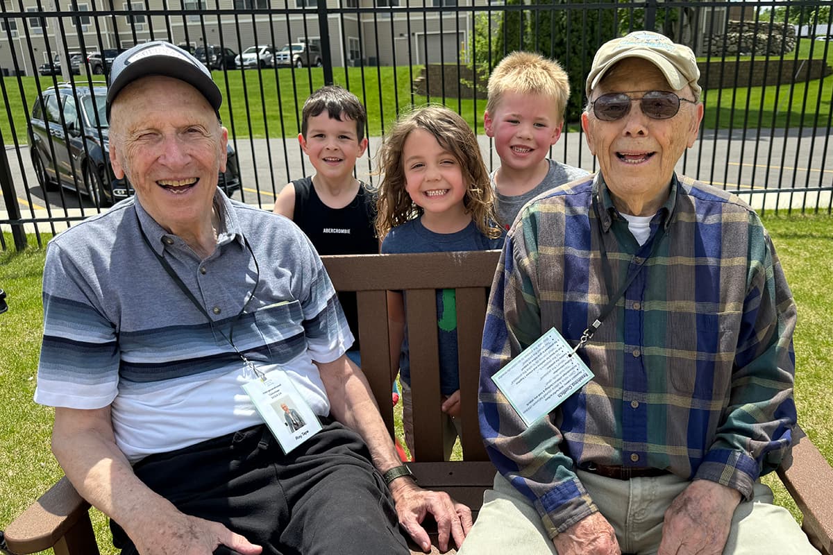 Residents and children enjoying outdoor time together