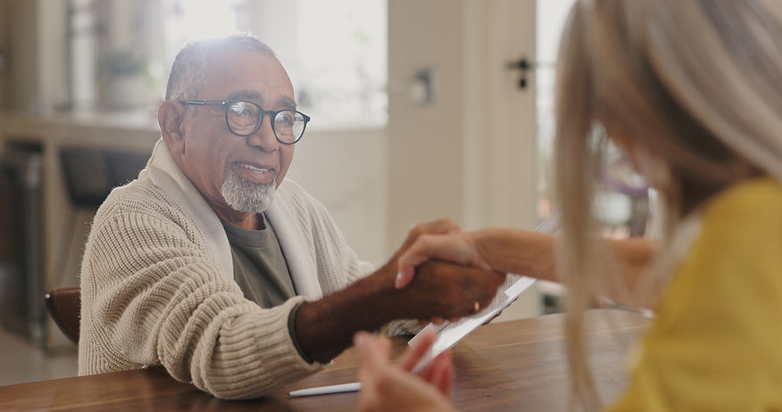 A man and woman engaging in conversation at a table.