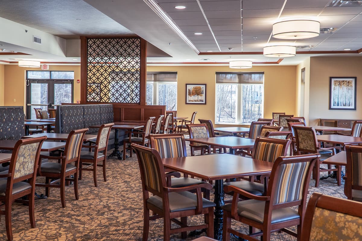 Interior view of a dining room with tables and chairs