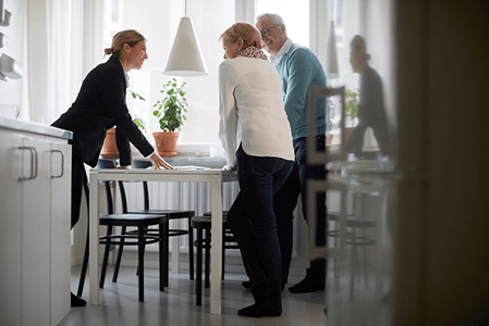 Residents and staff engaging around a table