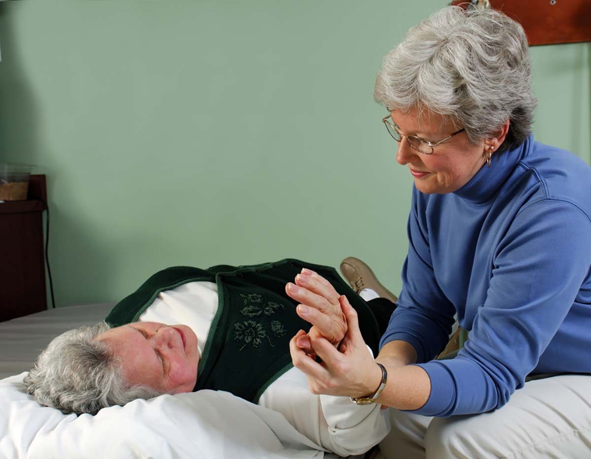 Caregiver assisting a resident in a caring environment