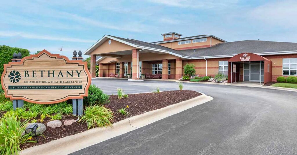 Exterior view of a senior living facility with signage