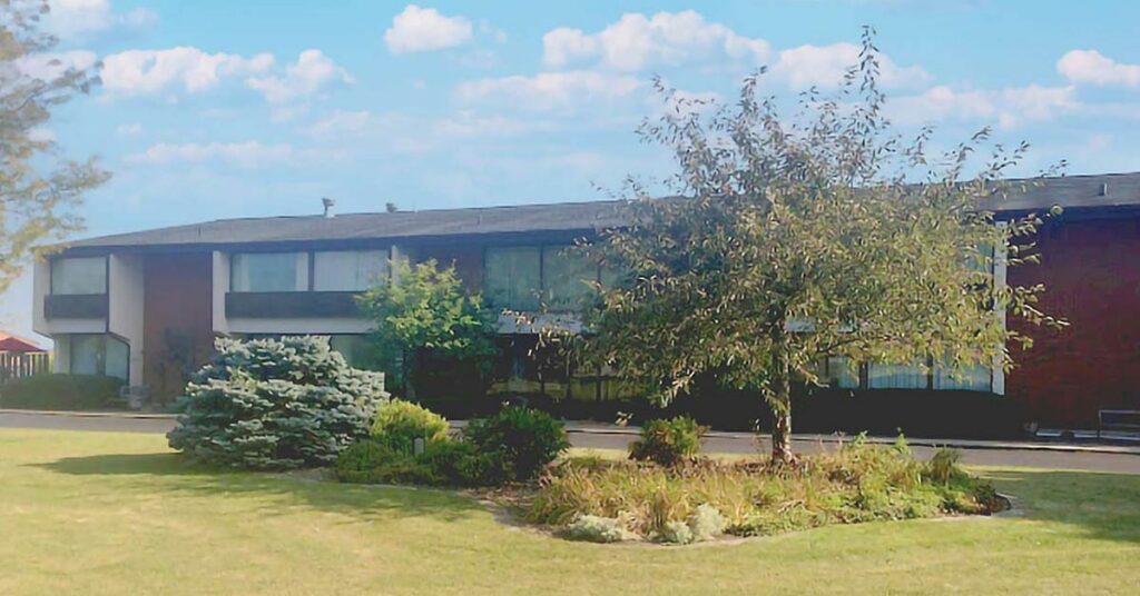 Exterior view of Antioch Valley Senior Living building with landscaping