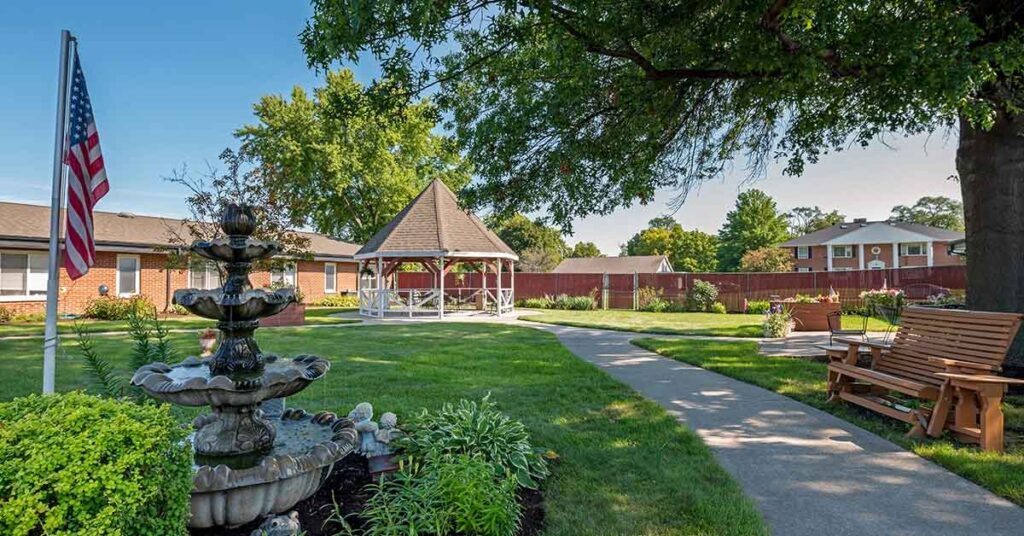 A serene outdoor space with gazebo and fountain