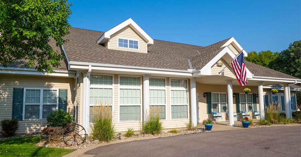 Exterior view of Antioch Valley Senior Living with an American flag