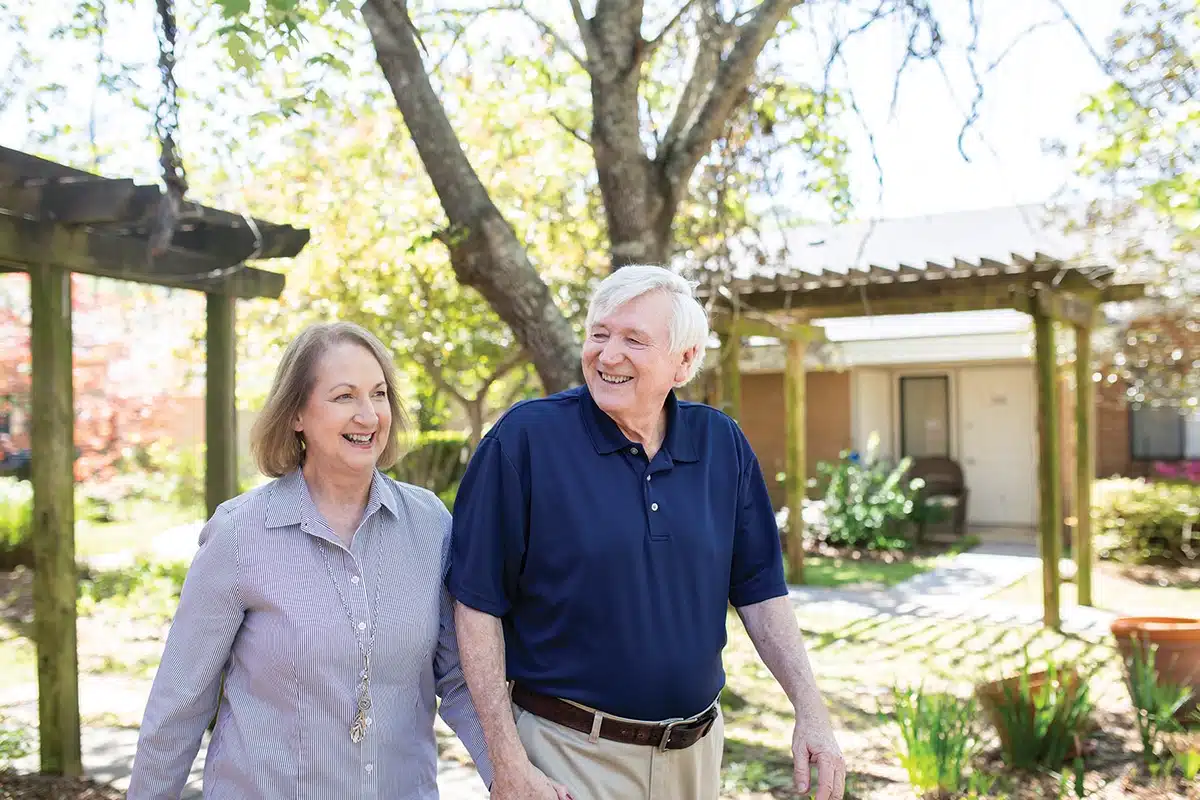 Couple enjoying a walk in the garden area