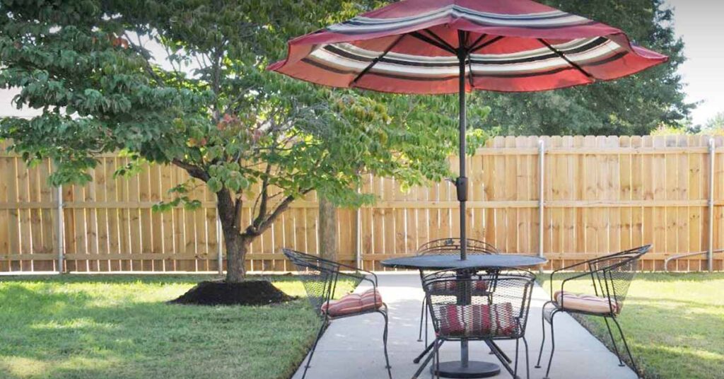 Outdoor seating area with umbrella and table