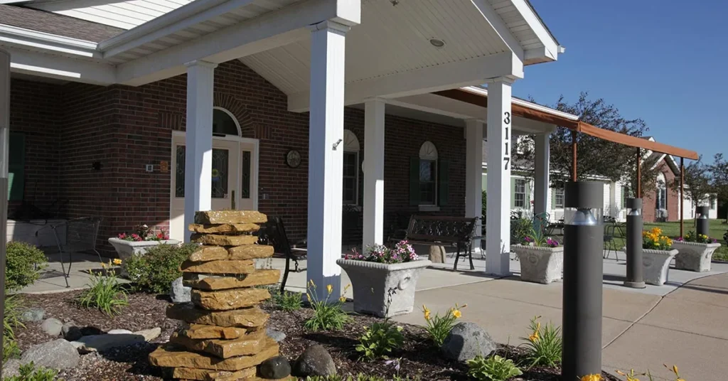 Exterior view of the front entrance with landscaping