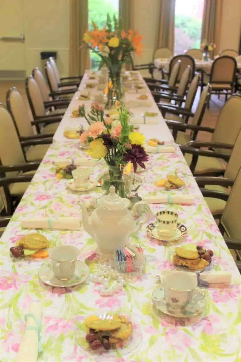 Beautifully set dining table with floral decorations