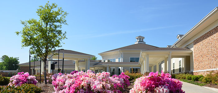 Building exterior with flowers and landscaping