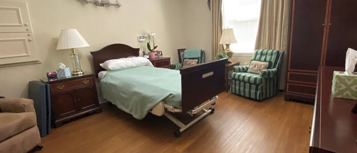 Cozy resident room with a bed and seating area