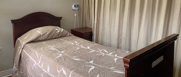 Cozy resident bedroom with a neatly made bed