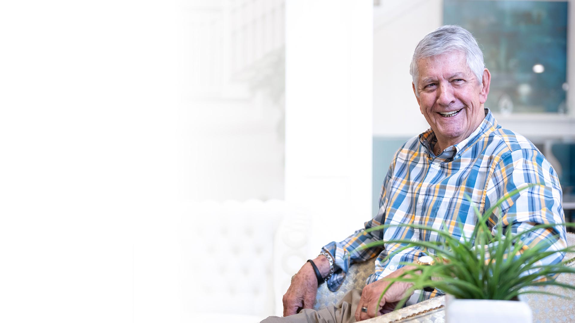 Senior resident smiling in a bright interior setting