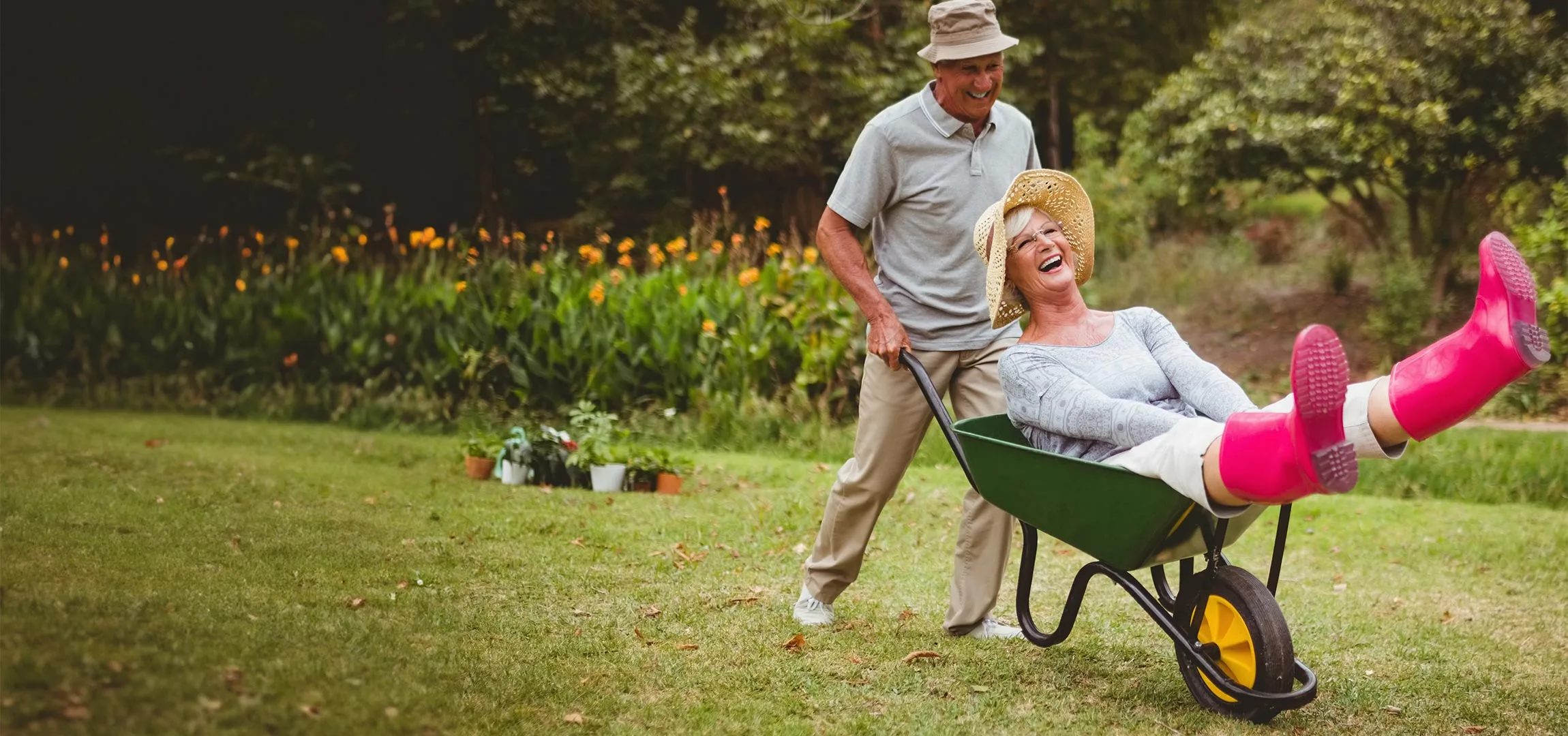 Residents enjoying gardening with a wheelbarrow