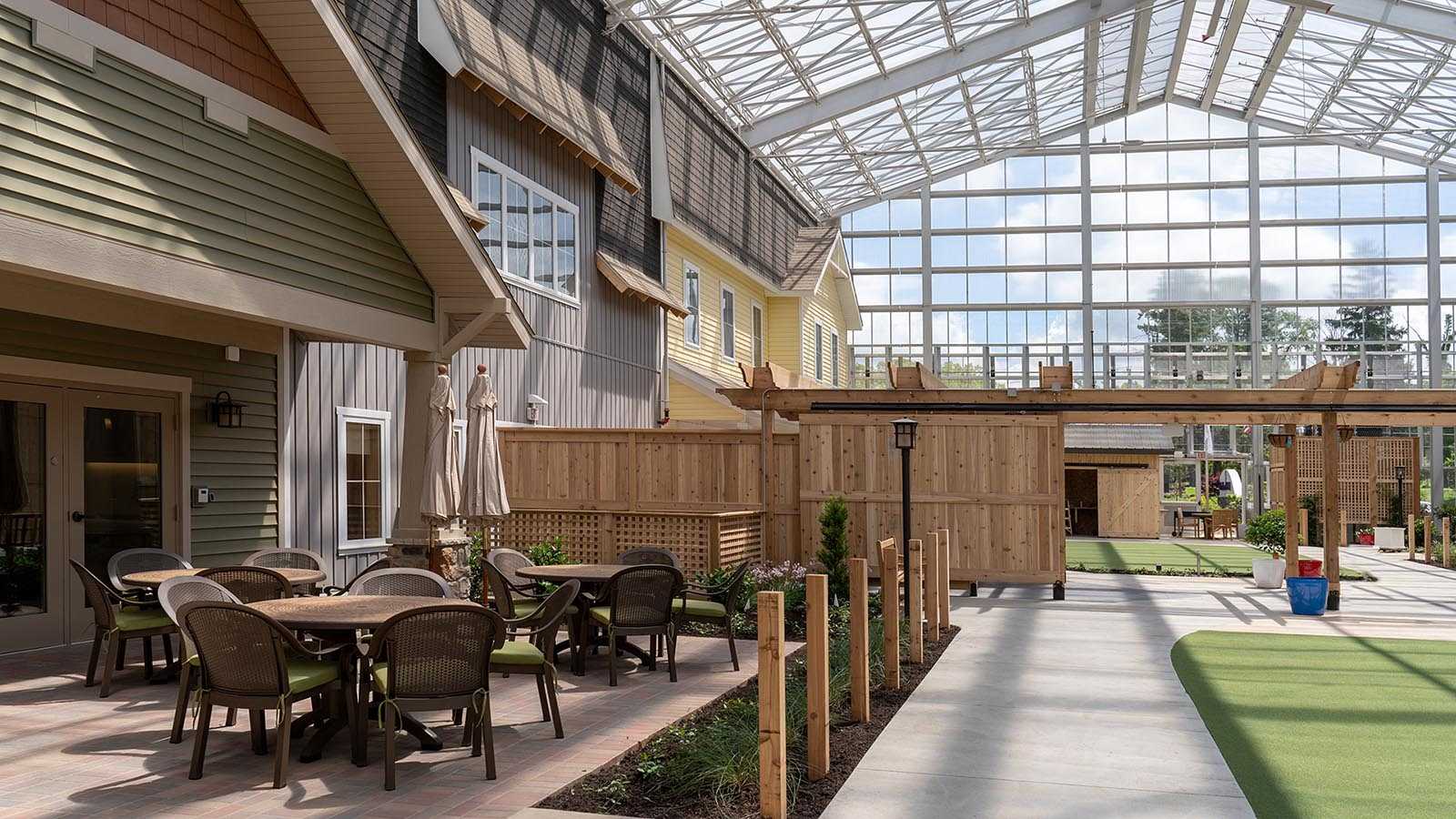 Outdoor patio area with seating and greenery