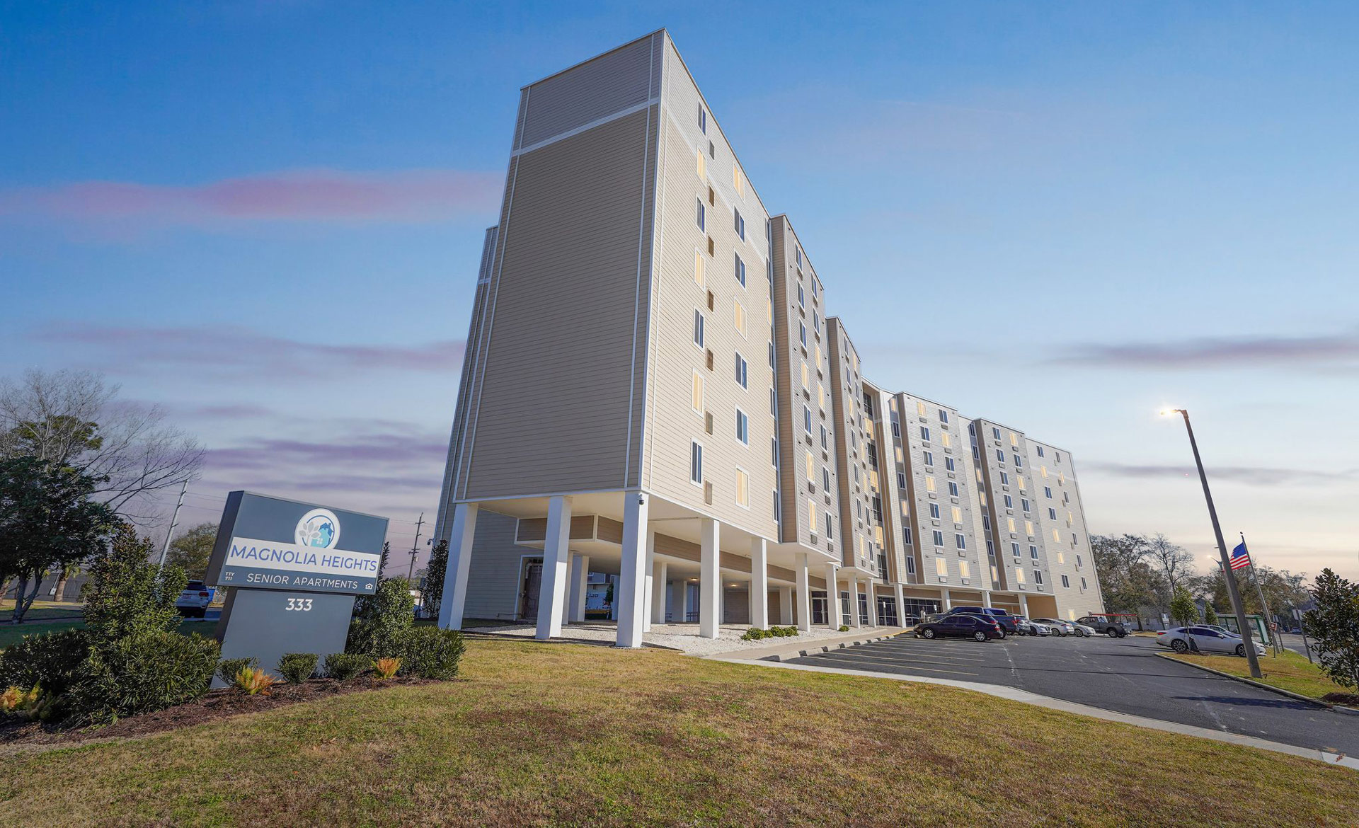 Exterior view of Magnolia Heights building with landscaped area