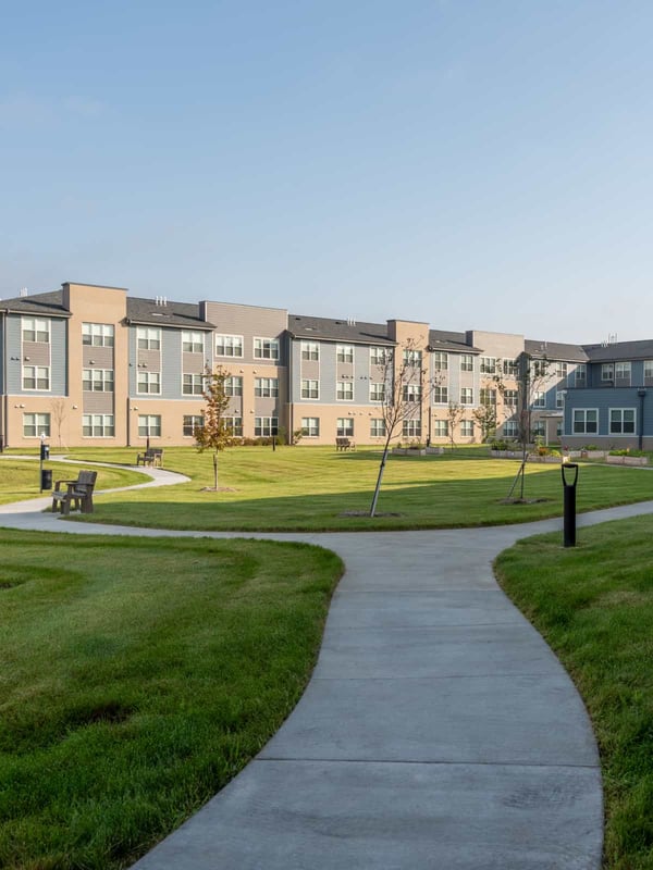 Pathway in a landscaped courtyard with buildings