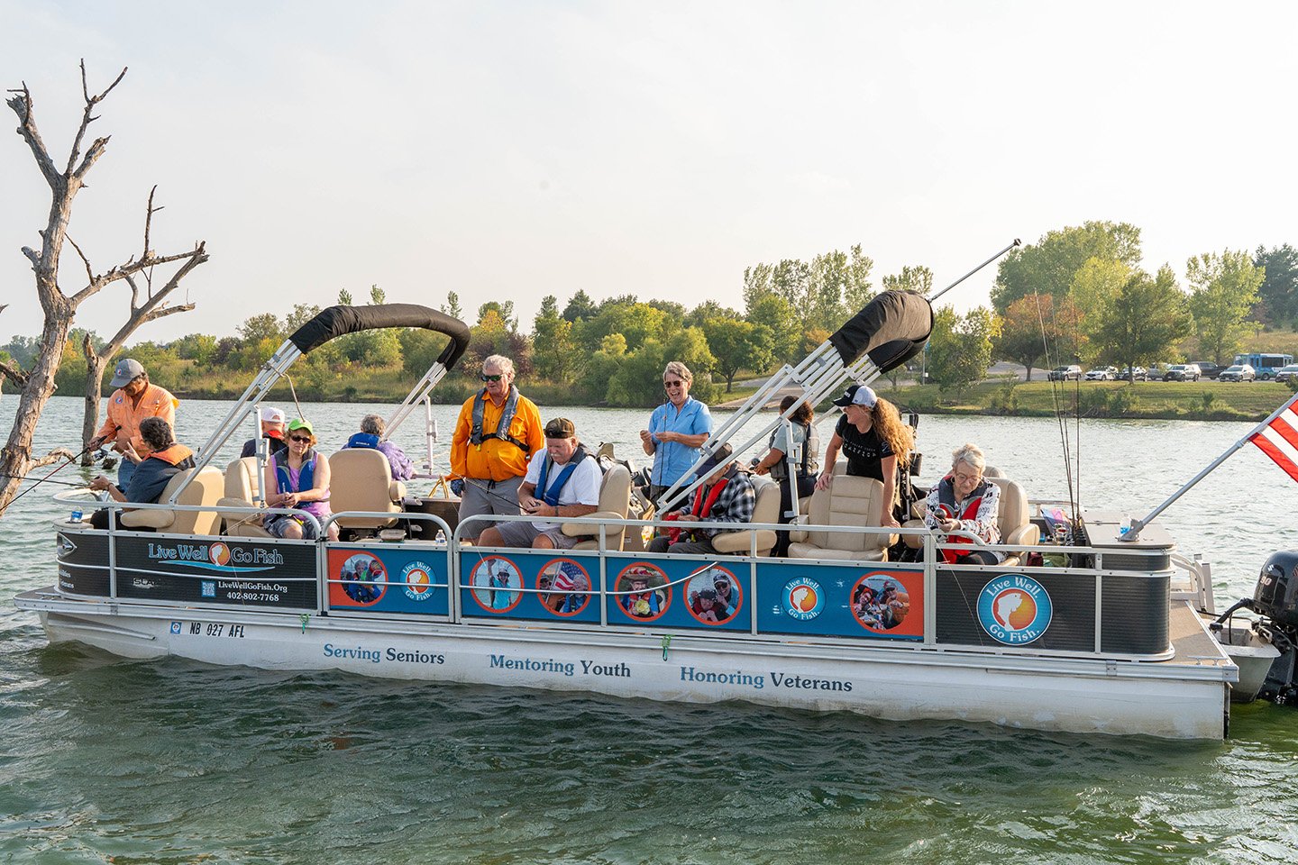 Seniors enjoying a boat ride on a lake