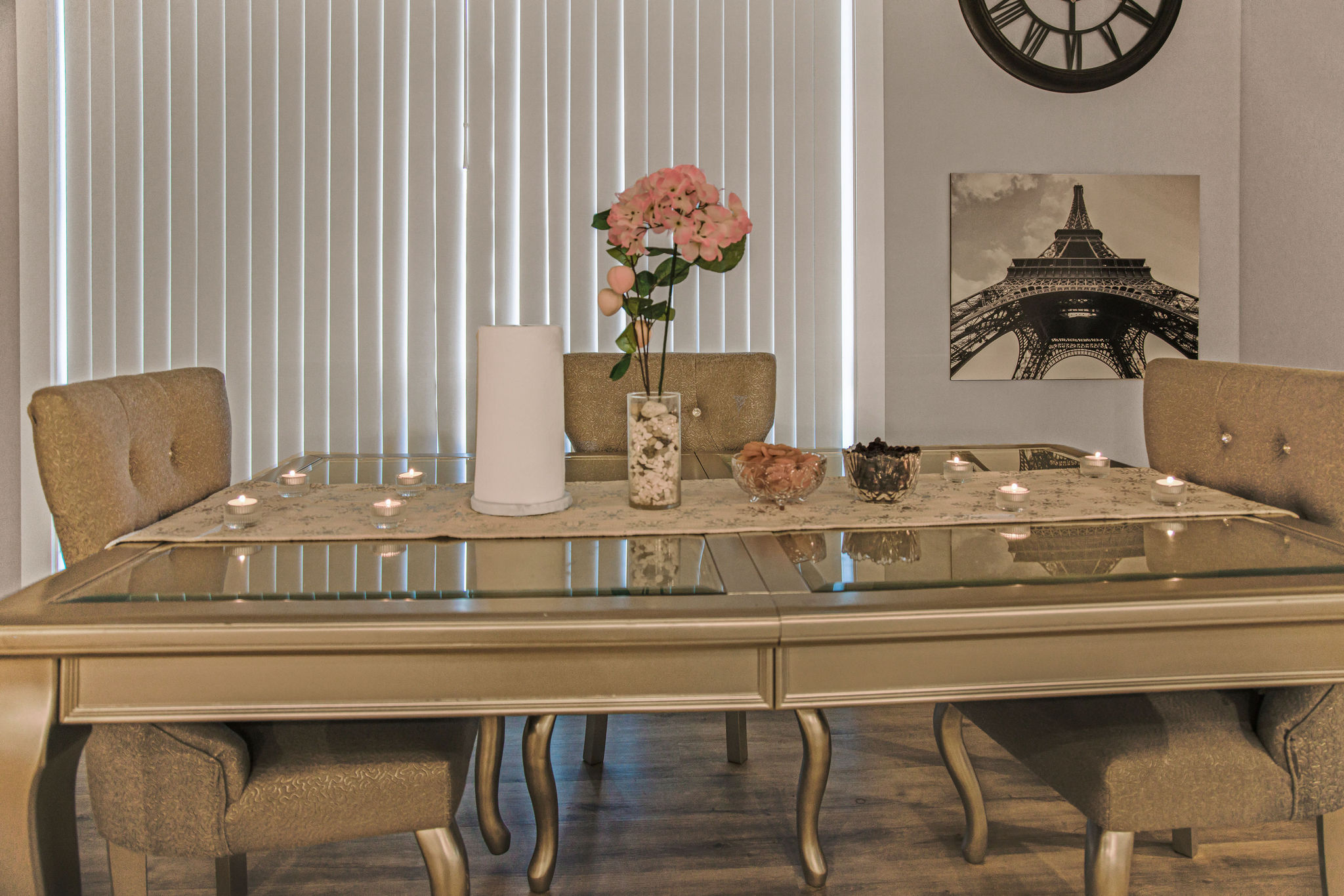 Elegantly set dining table with flowers and candles.
