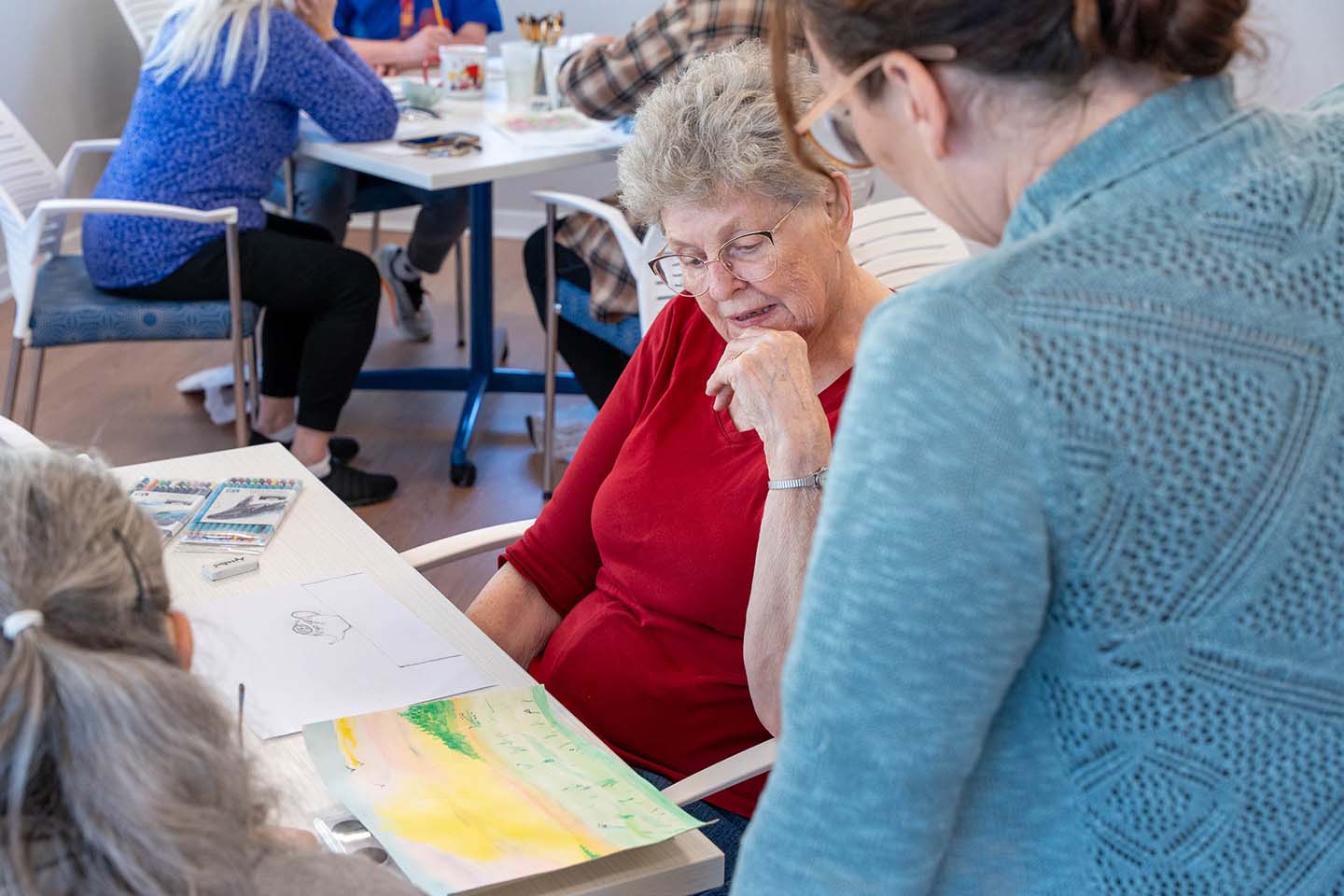 Residents engaged in a painting activity.