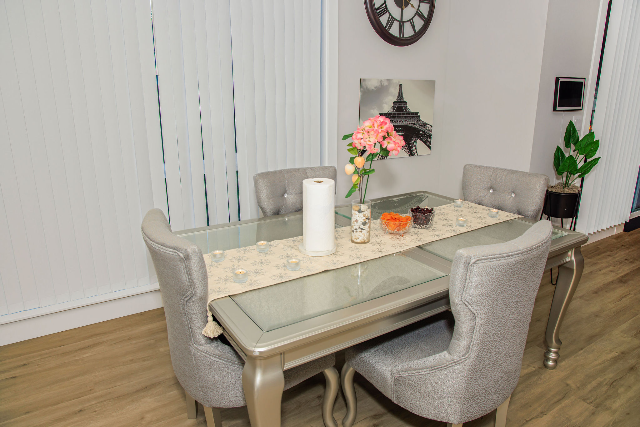 Dining table set with flowers and snacks