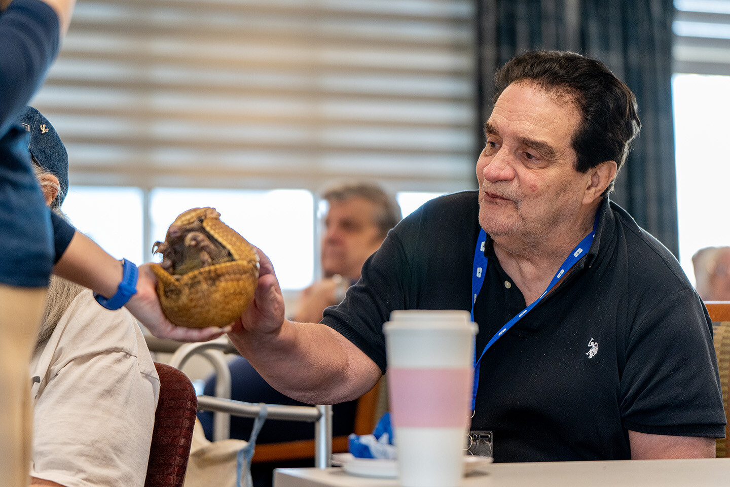 Resident engaging in activity with personal item