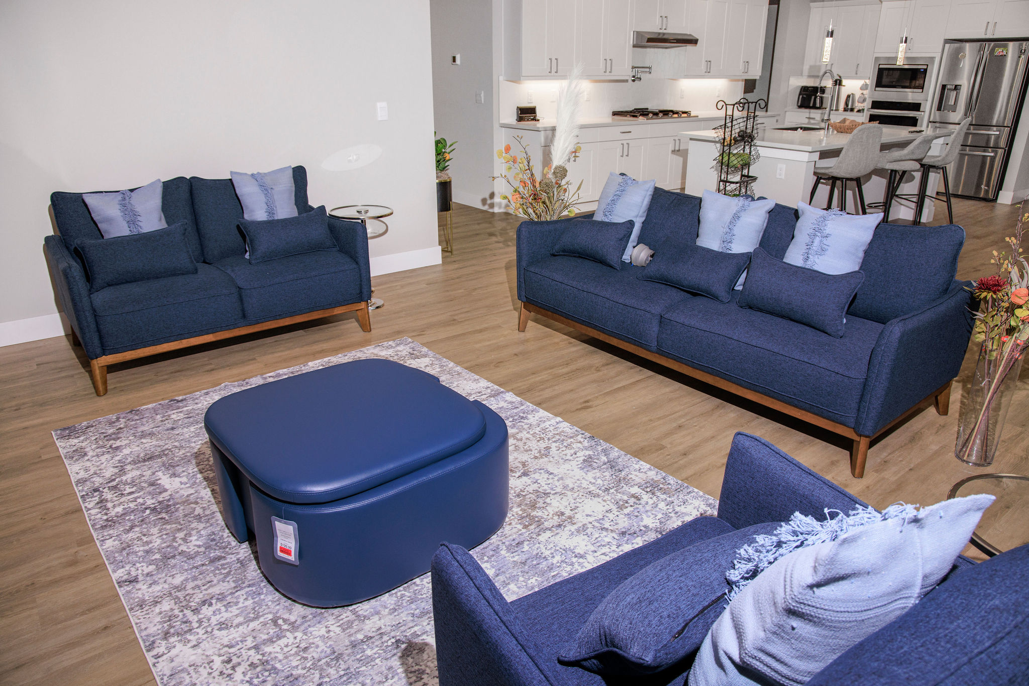 Modern interior seating area with blue sofas.