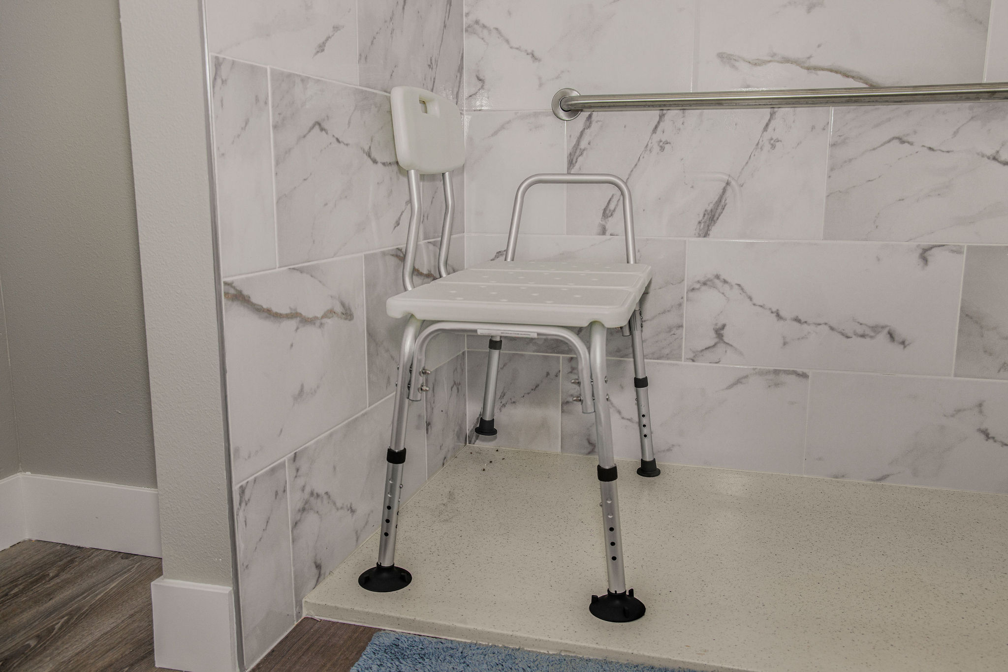 Shower chair in a tiled bathroom