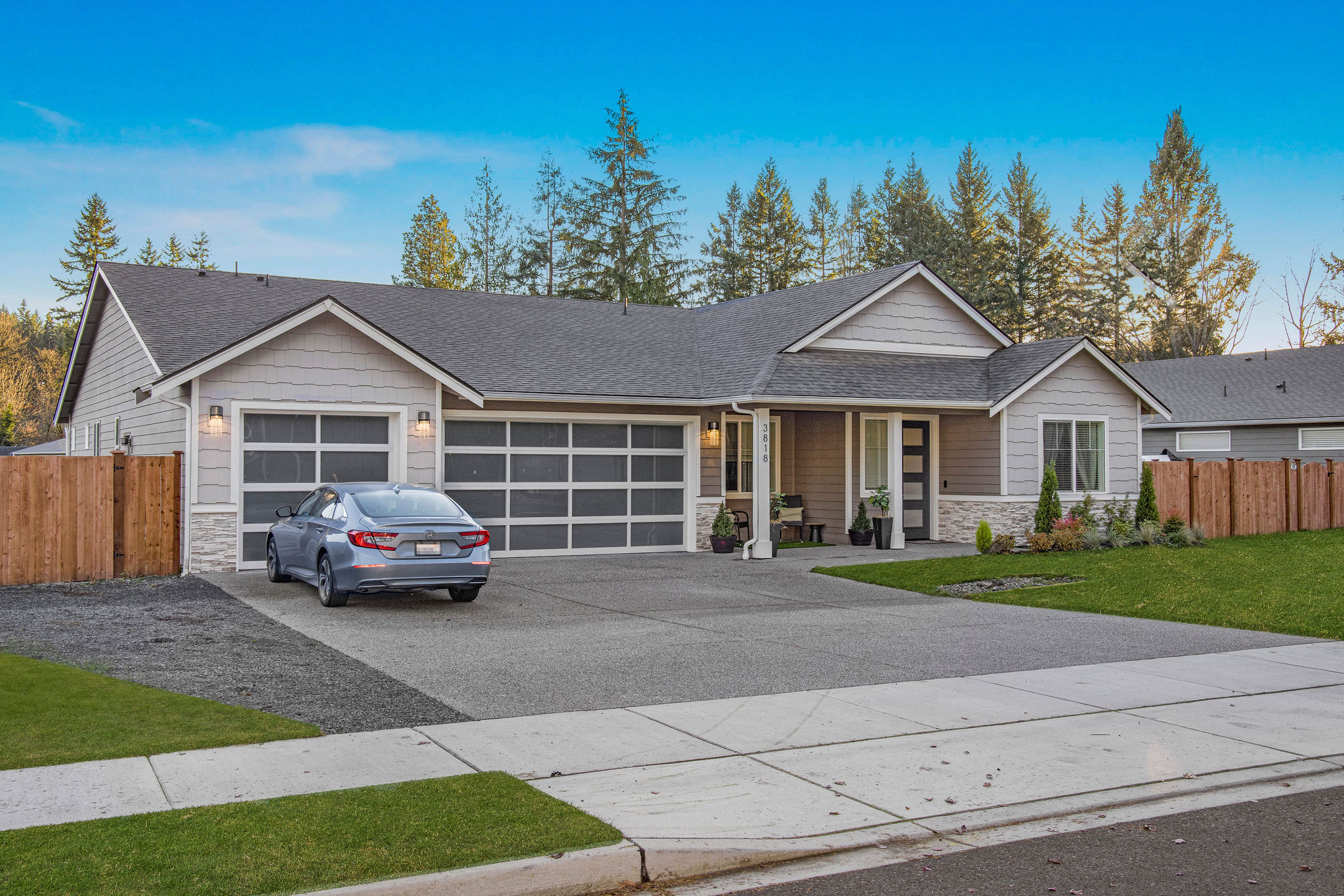 Exterior view of a residential building with a car.