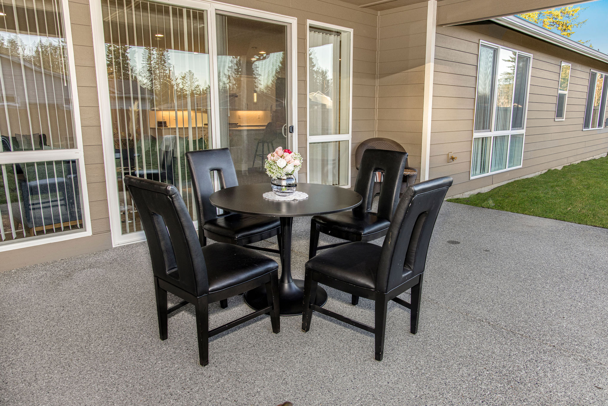 Outdoor seating area with a table and chairs.