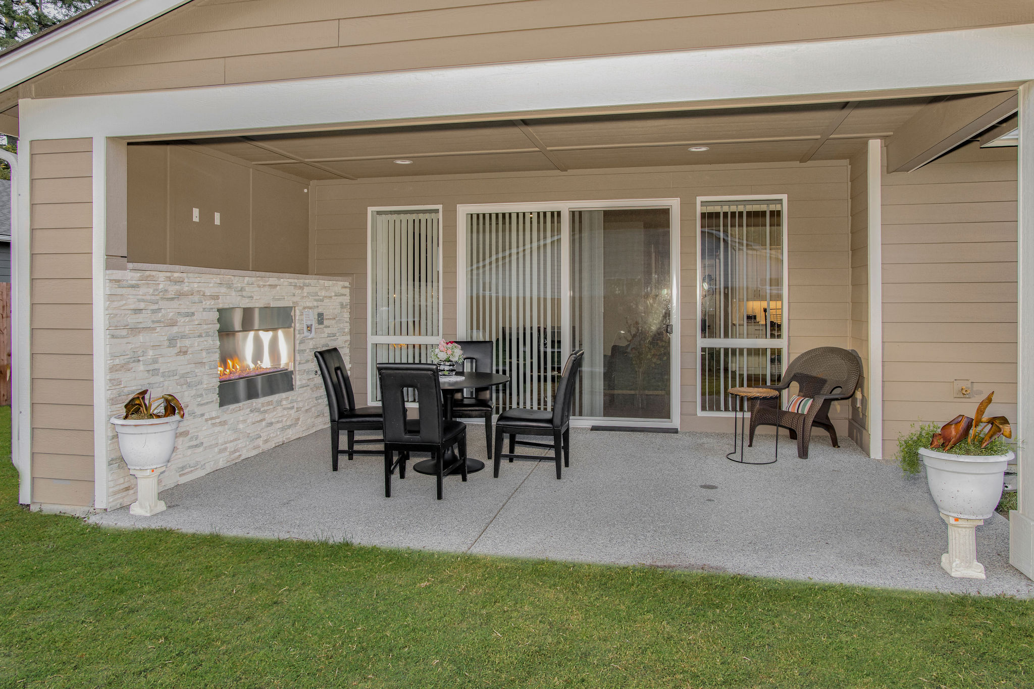 Patio seating area with a fireplace