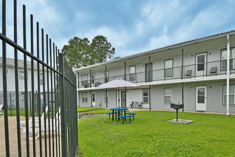 Outdoor space with seating and grill area