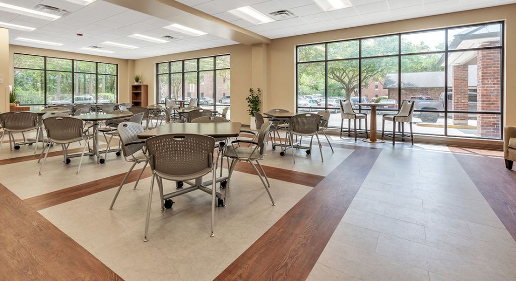 Spacious dining room with tables and chairs