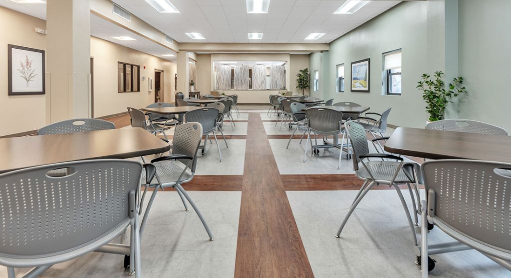 Interior view of a dining area with tables and chairs