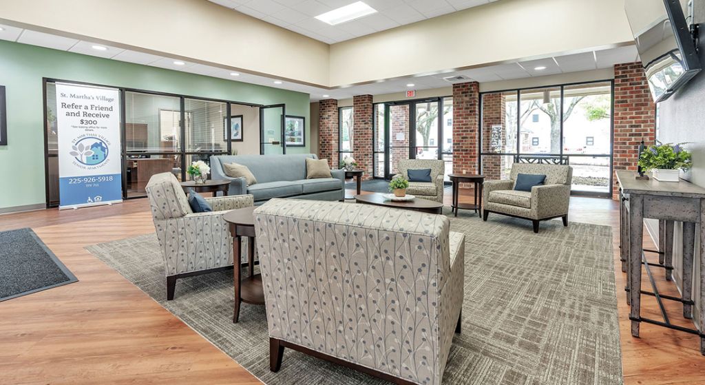 Well-furnished common area with seating and natural light
