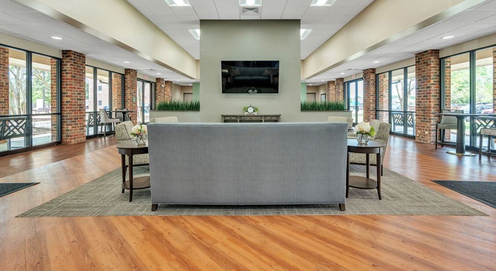 Modern common area with seating and large windows