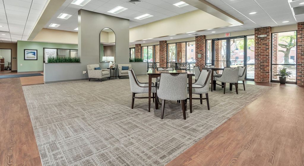 Bright common area with seating and natural light.