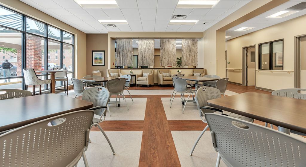 Bright common area with seating and tables