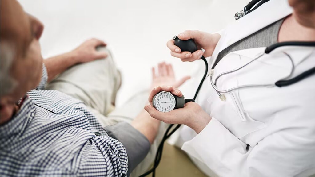 Healthcare professional measuring blood pressure