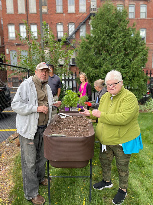Residents gardening together in an outdoor space