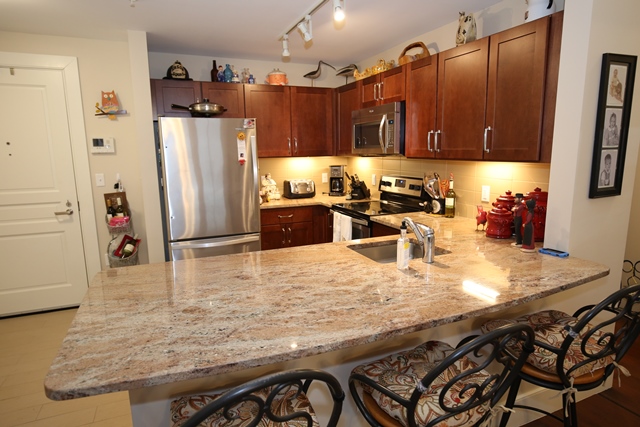 Modern kitchen area with a granite countertop