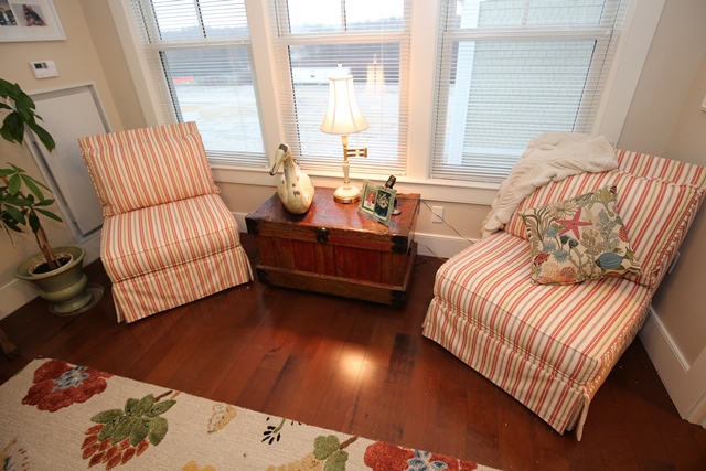 Cozy seating area with two striped chairs