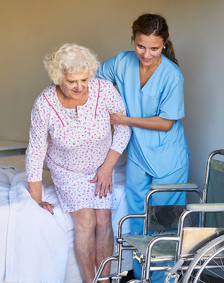 Caregiver assisting a resident in a room