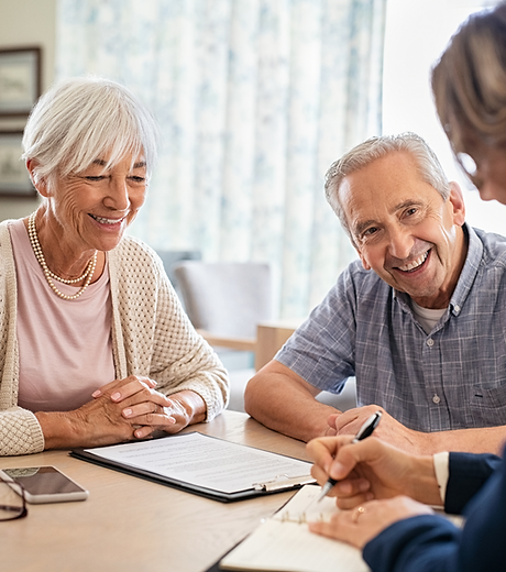 Residents and staff engaged in conversation.