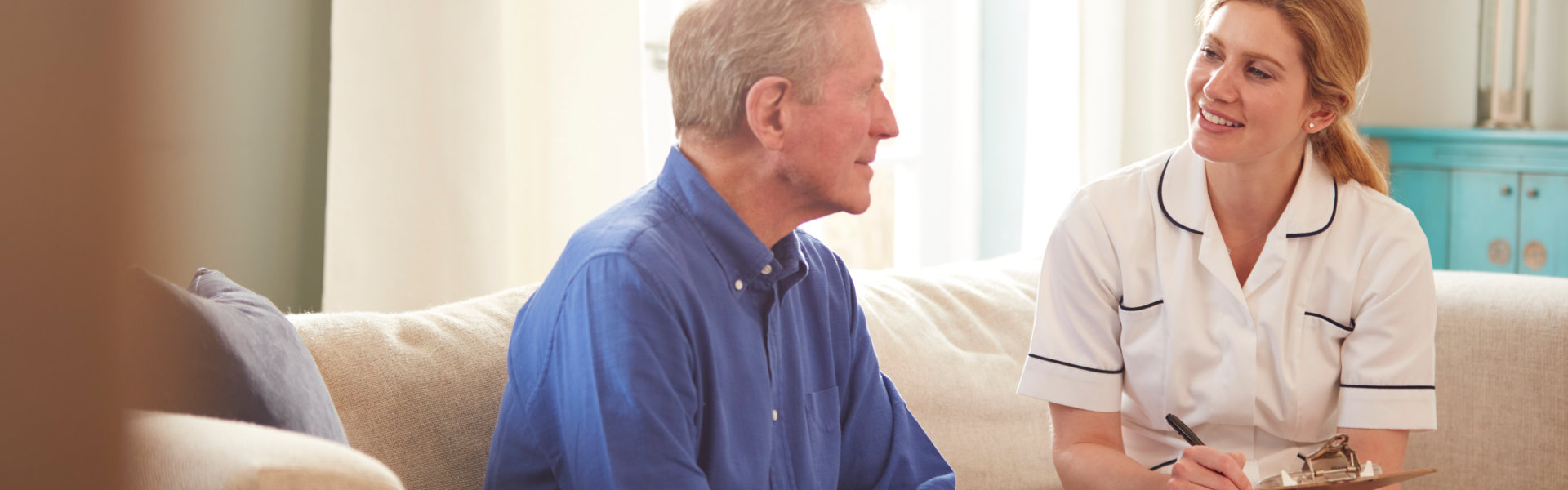 Caregiver interacting with a senior man