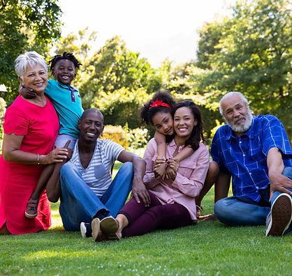 Multigenerational family enjoying a sunny outdoor space.