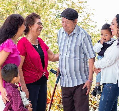 Group of people enjoying conversation in a garden